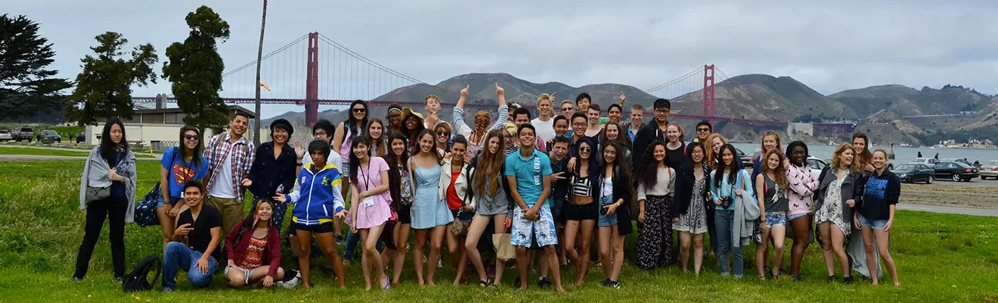 large group of students in front of golden gate bridge